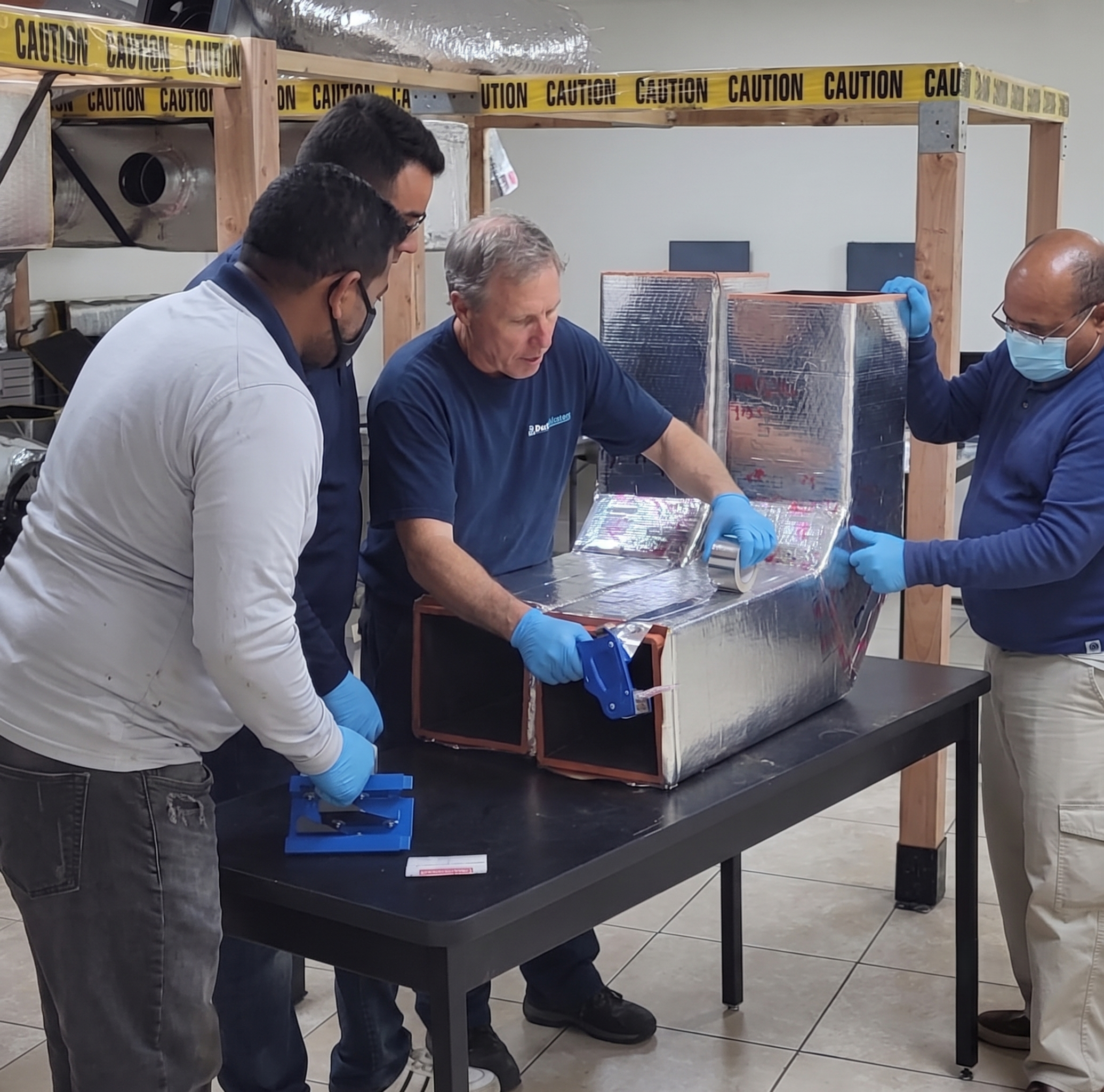 Duct Masters owner training technicians in-house on professional duct cleaning protocols